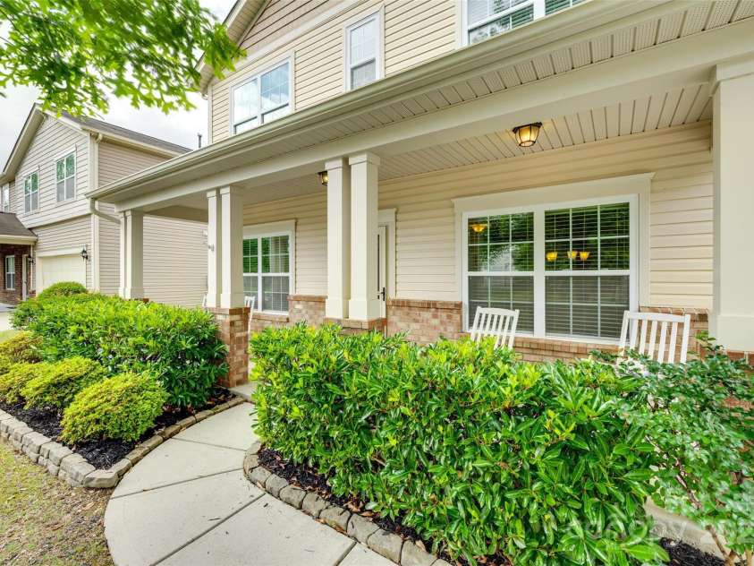 1412 Afternoon Sun Road, Matthews, NC 28104.  MLS# CAR4259106, YatesRealty ID 26877. Rocking Chair Front Porch