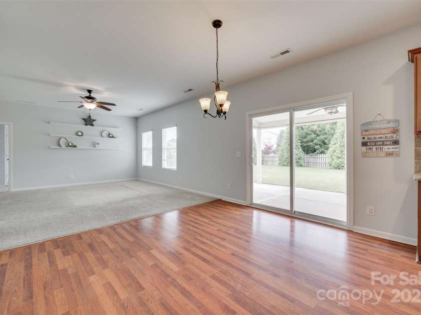 1412 Afternoon Sun Road, Matthews, NC 28104.  MLS# CAR4259106, YatesRealty ID 26877. Slinding glass door to HUGE covered patio