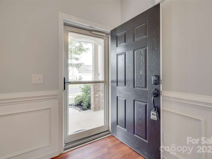 1412 Afternoon Sun Road, Matthews, NC 28104.  MLS# CAR4259106, YatesRealty ID 26877. Storm door on front door for added light