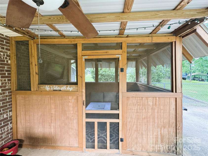136 Christopher Road, Marion, NC 28752.  MLS# CAR4267352, YatesRealty ID 26878. Outside screened in patio area