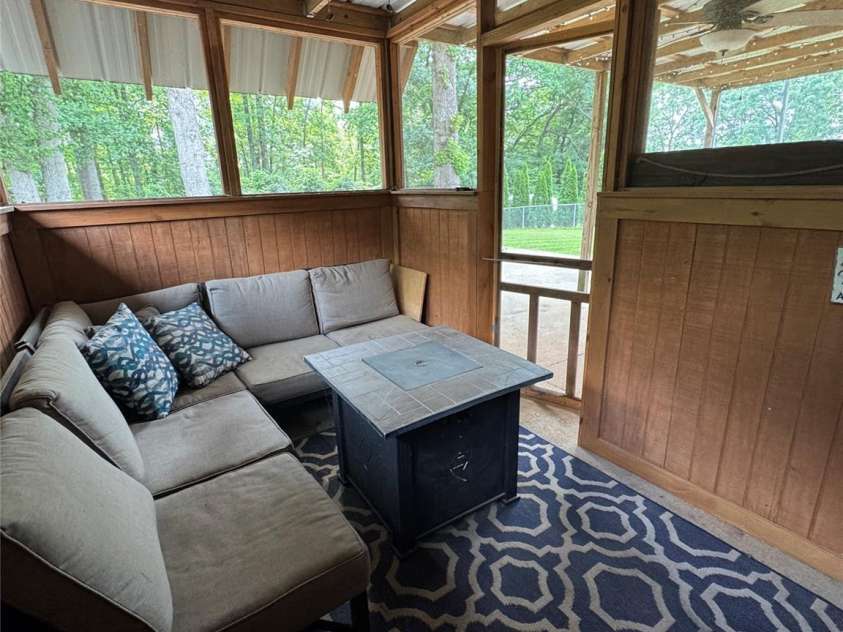 136 Christopher Road, Marion, NC 28752.  MLS# CAR4267352, YatesRealty ID 26878. Screened in patio area