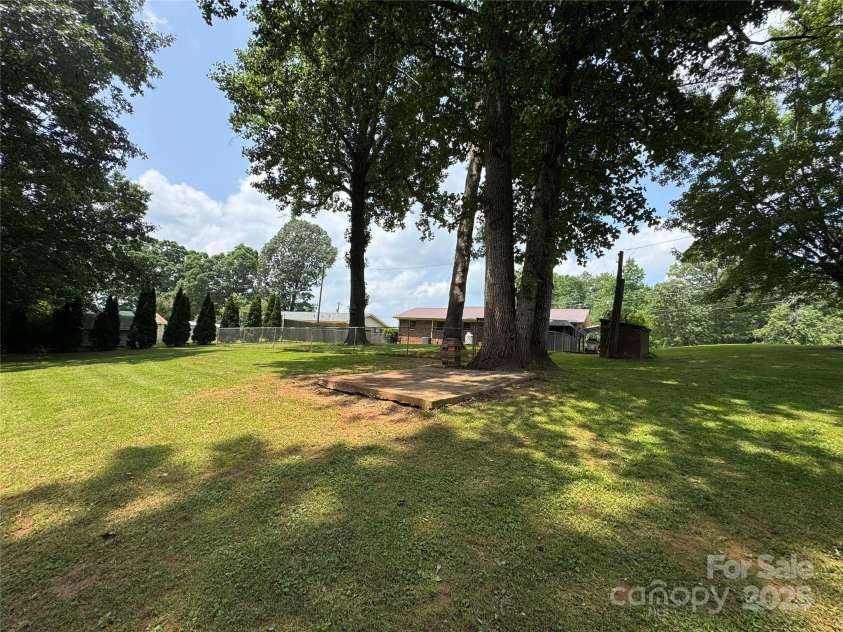 136 Christopher Road, Marion, NC 28752.  MLS# CAR4267352, YatesRealty ID 26878. View from wooded area toward house