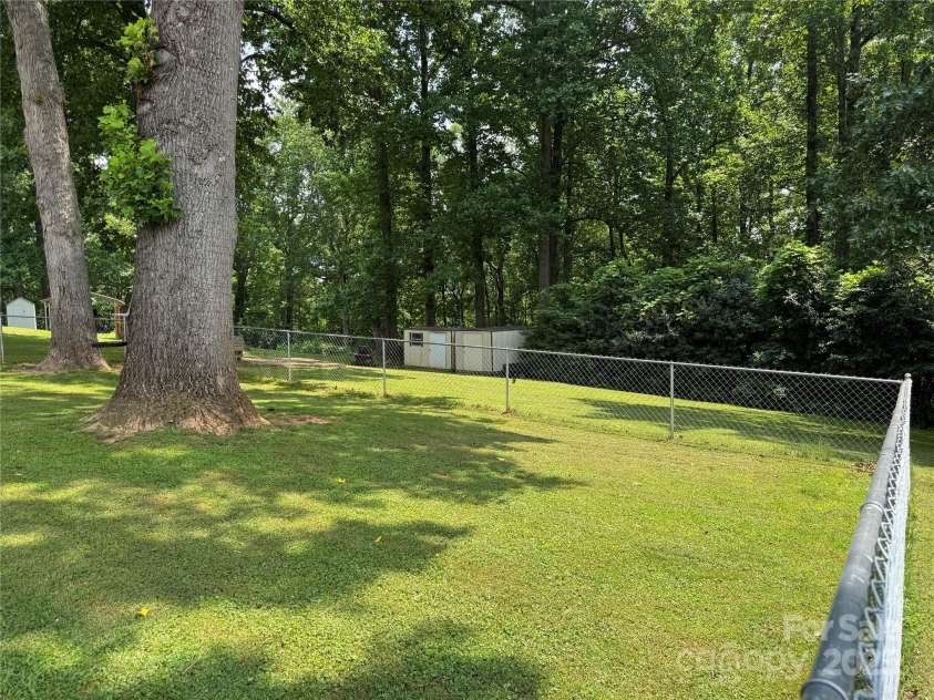 136 Christopher Road, Marion, NC 28752.  MLS# CAR4267352, YatesRealty ID 26878. View of fenced in back yard