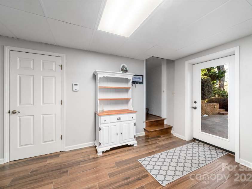 113 Pait Drive, Hendersonville, NC 28791.  MLS# CAR4218353, YatesRealty ID 2688. Exterior entrance, to left are stairs up to main level