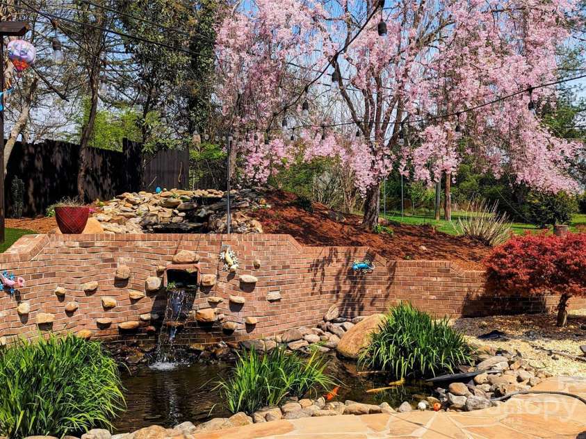 113 Pait Drive, Hendersonville, NC 28791.  MLS# CAR4218353, YatesRealty ID 2688. KOI Pond