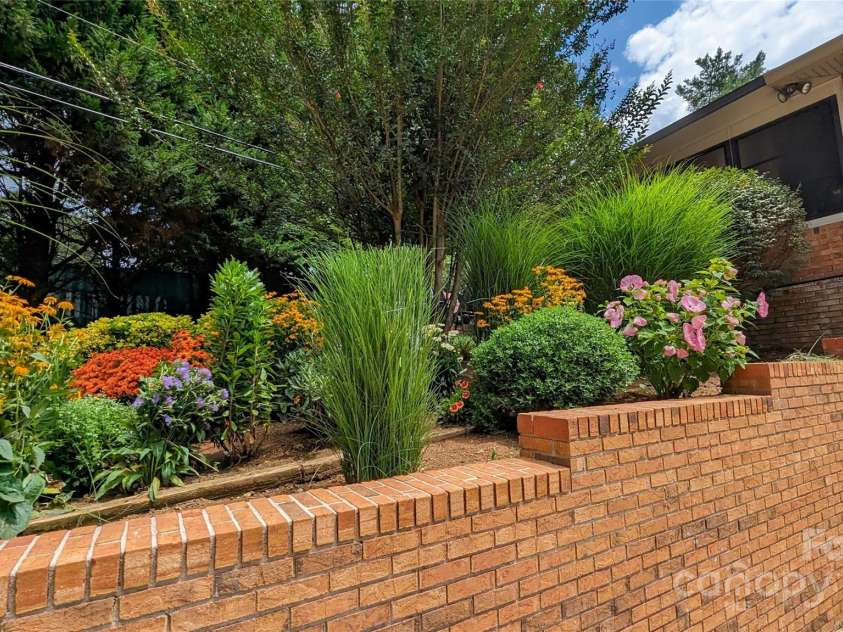 113 Pait Drive, Hendersonville, NC 28791.  MLS# CAR4218353, YatesRealty ID 2688. Perennial flowers all season long