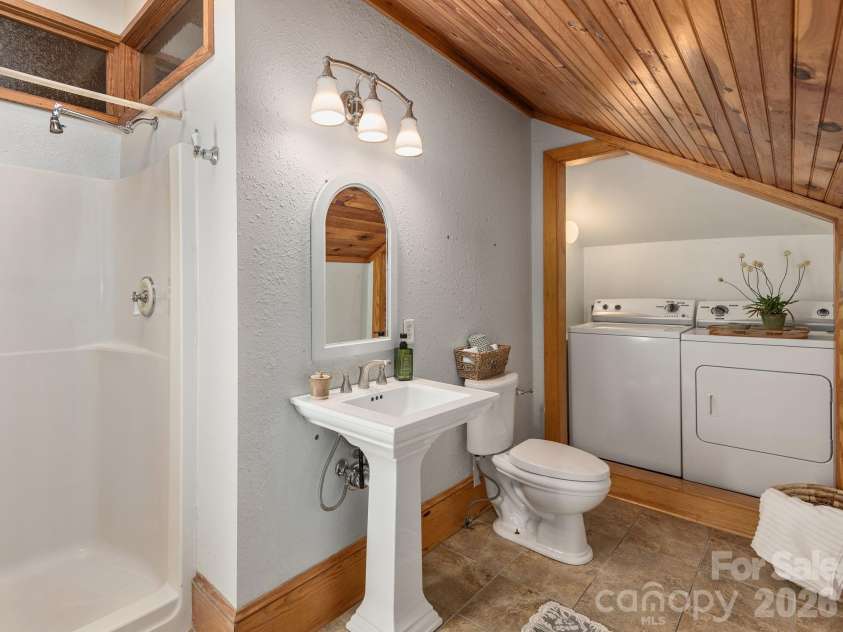 15 Hillside Street, Asheville, NC 28801.  MLS# CAR4350045, YatesRealty ID 26883. Ensuite Bathroom and Laundry