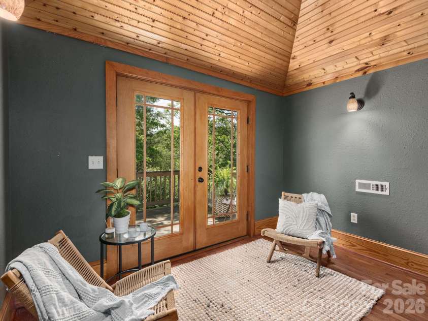 15 Hillside Street, Asheville, NC 28801.  MLS# CAR4350045, YatesRealty ID 26883. Owner's suite lounge with access to upper deck