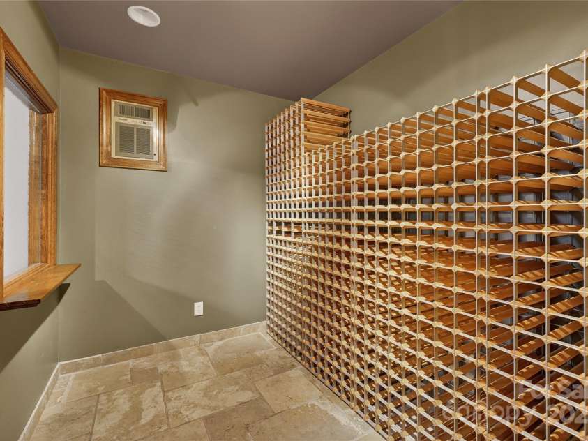 6800 Augustine Way, Charlotte, NC 28270.  MLS# CAR4331637, YatesRealty ID 26883. Wine room in basement 