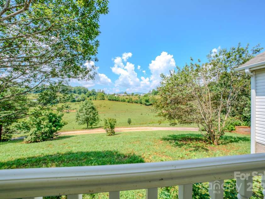 19 New Liberty Road, Leicester, NC 28748.  MLS# CAR4278479, YatesRealty ID 26888. Beautiful landscape view of pasture and cows