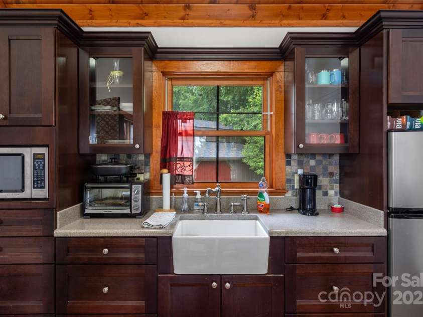 4862 Pinnacle Mountain Road, Zirconia, NC 28790.  MLS# CAR4262983, YatesRealty ID 26893. Guest Cabin Kitchen