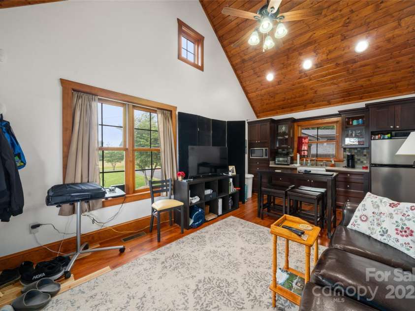 4862 Pinnacle Mountain Road, Zirconia, NC 28790.  MLS# CAR4262983, YatesRealty ID 26893. Guest Cabin Living Room