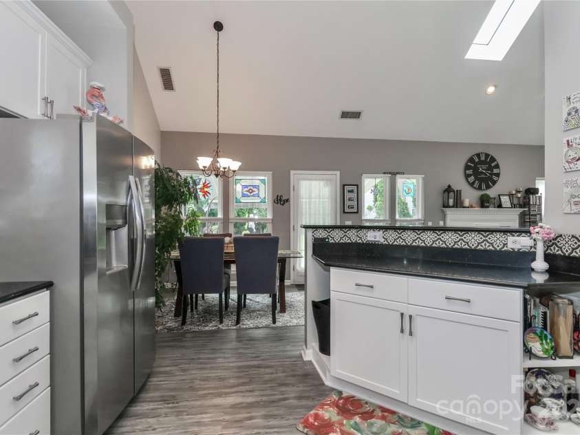 103 Pamlico Lane, Mooresville, NC 28117.  MLS# CAR4273321, YatesRealty ID 26894. 103 Pamlico Lane Kitchen to Dining Area