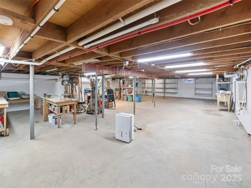 3829 Coxes Creek Road, Burnsville, NC 28714.  MLS# CAR4246043, YatesRealty ID 26911. Deep welled Sink, Metal shelfing for storage 