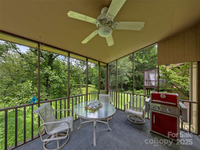 128 View De Lake Drive, Etowah, NC 28729.  MLS# CAR4274148, YatesRealty ID 26919. Enjoy morning coffee on the main level screened in porch