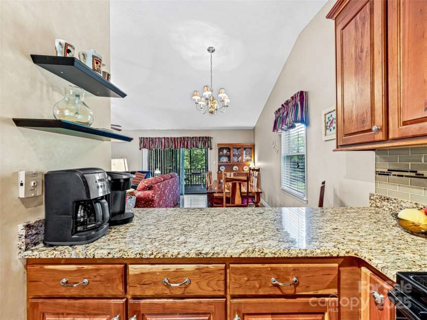 128 View De Lake Drive, Etowah, NC 28729.  MLS# CAR4274148, YatesRealty ID 26919. Nice coffee station or bar area open to dining and living room
