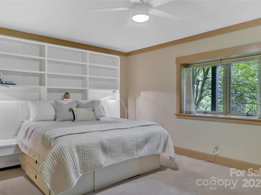 24 Westhaven Drive, Asheville, NC 28804.  MLS# CAR4269896, YatesRealty ID 26929. Lower level bedroom with large closet and ensuite bathroom