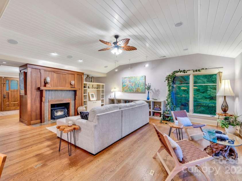 24 Westhaven Drive, Asheville, NC 28804.  MLS# CAR4269896, YatesRealty ID 26929. The amply-sized great room offers flexible seating arrangements, creating the option for one unified gathering space instead of the current two separate areas