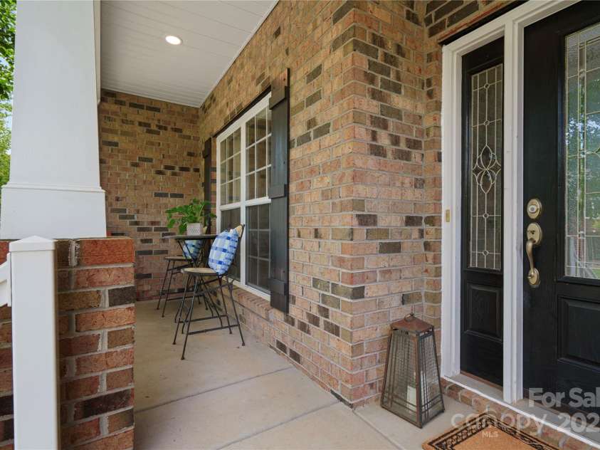422 Deer Brush Lane, Waxhaw, NC 28173.  MLS# CAR4253488, YatesRealty ID 26930. Elegant brick front covered front porch