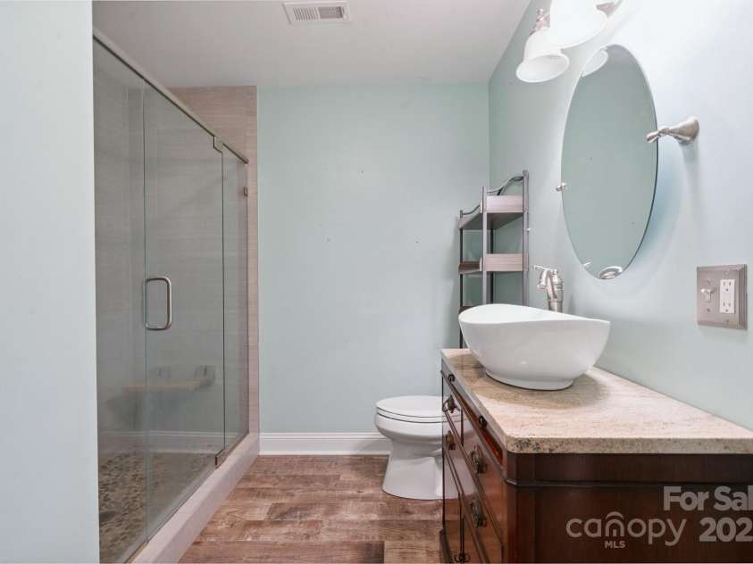 612 Berry Hill Drive, Norwood, NC 28128.  MLS# CAR4267025, YatesRealty ID 26932. Full Bathroom In Basement With Heated Tile Floor