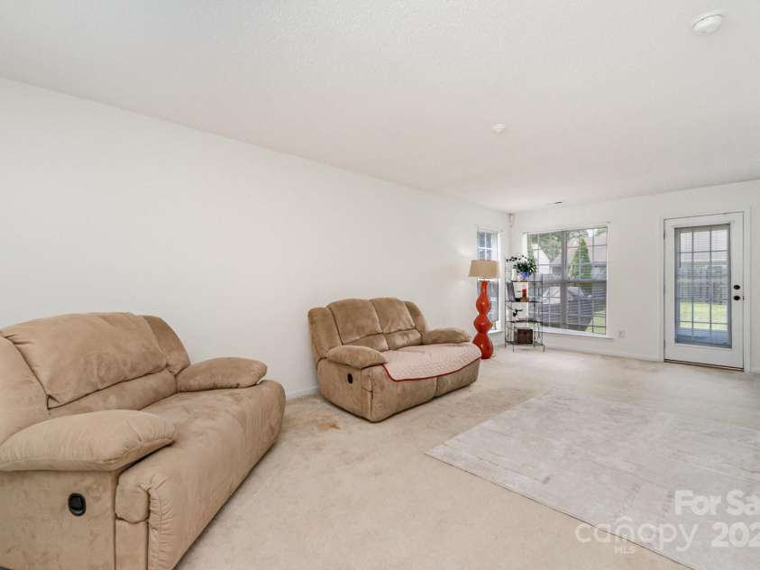 10506 Gold Pan Road, Charlotte, NC 28215.  MLS# CAR4280921, YatesRealty ID 26948. Lving room stretches from the front of the house to the back!!