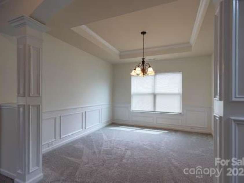 159 Saye Place, Mooresville, NC 28115.  MLS# CAR4255738, YatesRealty ID 26952. Tray ceiling enhances the Dining Room