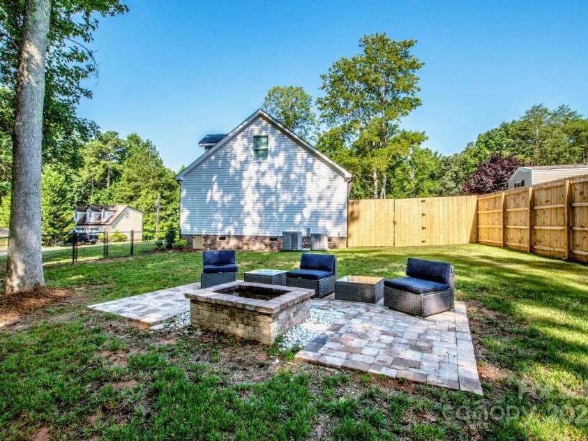 7039 Executive Circle, Denver, NC 28037.  MLS# CAR4275891, YatesRealty ID 26953. Fire pit and side yard