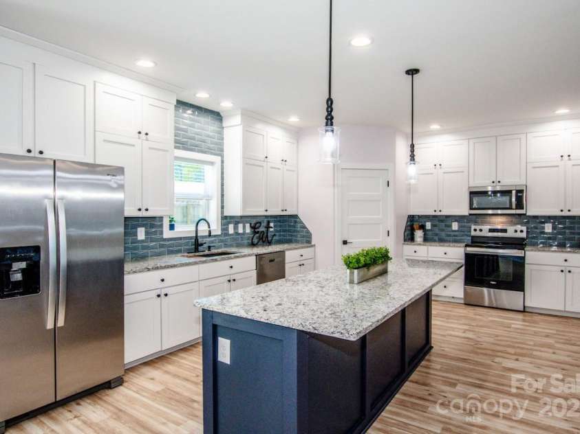 7039 Executive Circle, Denver, NC 28037.  MLS# CAR4275891, YatesRealty ID 26953. Granite counters and island