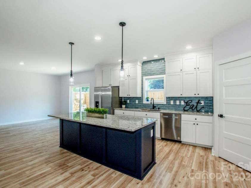 7039 Executive Circle, Denver, NC 28037.  MLS# CAR4275891, YatesRealty ID 26953. Kitchen with large walk-in pantry