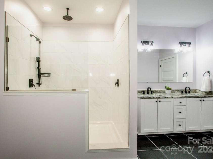 7039 Executive Circle, Denver, NC 28037.  MLS# CAR4275891, YatesRealty ID 26953. Primary bath with large shower and dual sinks