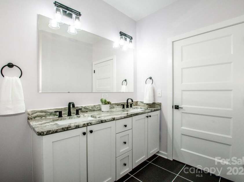 7039 Executive Circle, Denver, NC 28037.  MLS# CAR4275891, YatesRealty ID 26953. Primary suite dual granite vanity