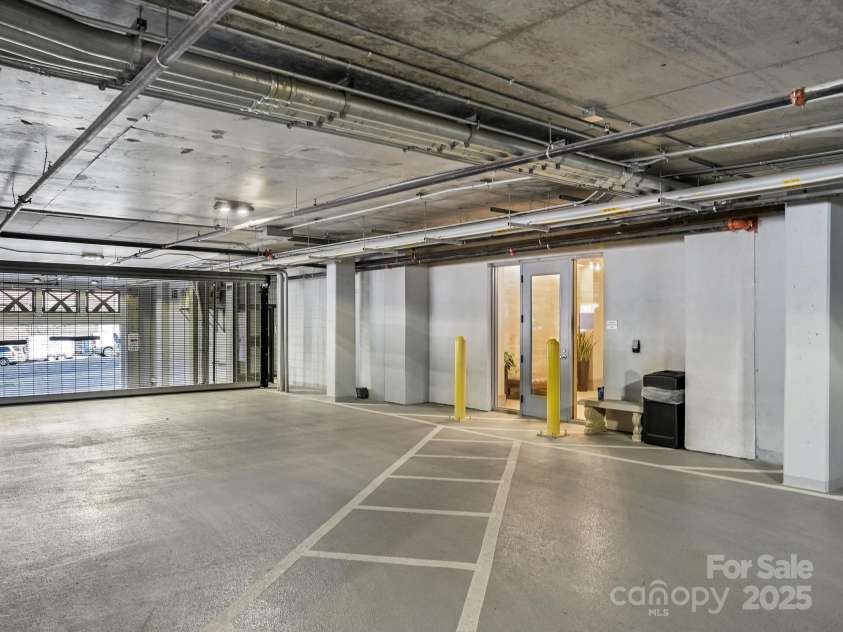 7 Patton Avenue, Asheville, NC 28801.  MLS# CAR4302588, YatesRealty ID 2697. Attached parking garage entry