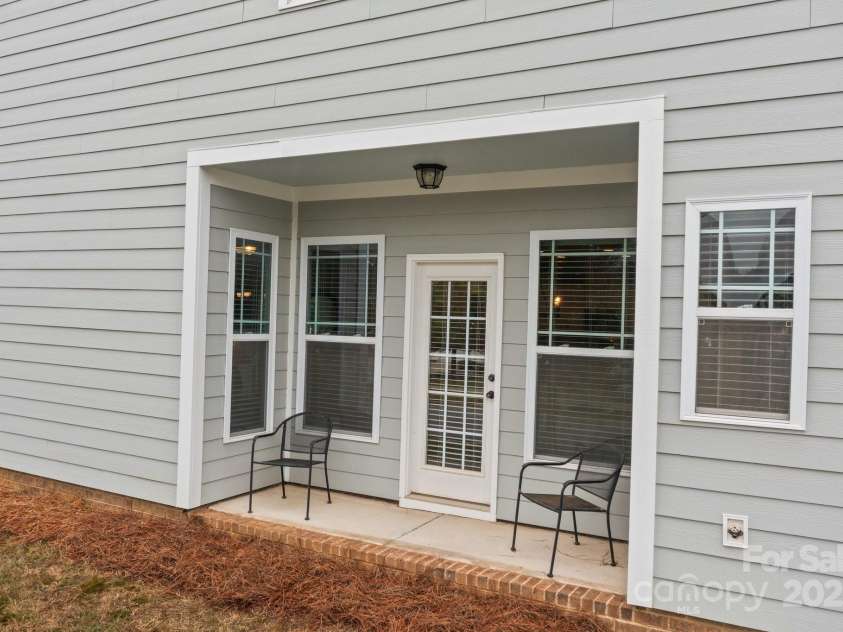 16034 Rushwick Drive, Huntersville, NC 28078.  MLS# CAR4262990, YatesRealty ID 26972. Coffee porch on side of home