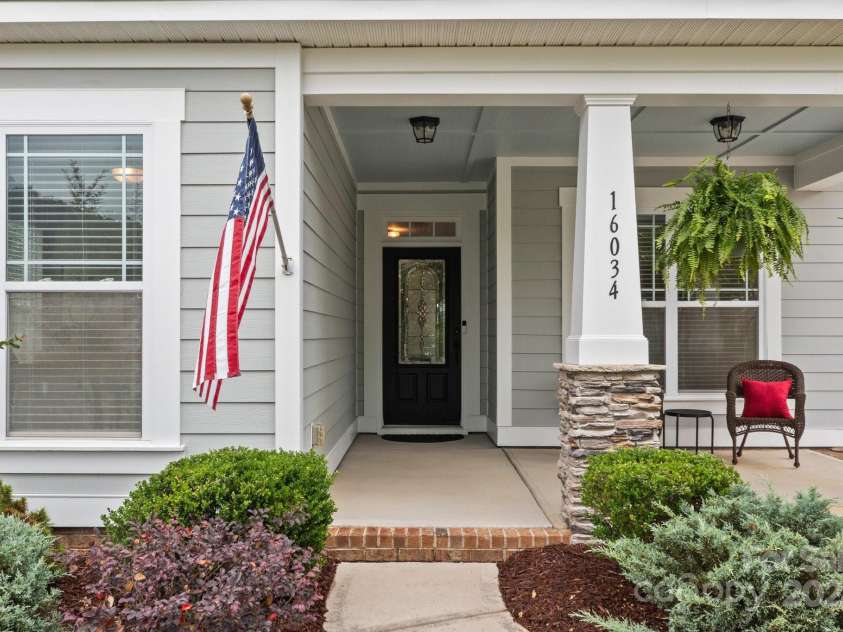 16034 Rushwick Drive, Huntersville, NC 28078.  MLS# CAR4262990, YatesRealty ID 26972. Inviting front porch greets guests