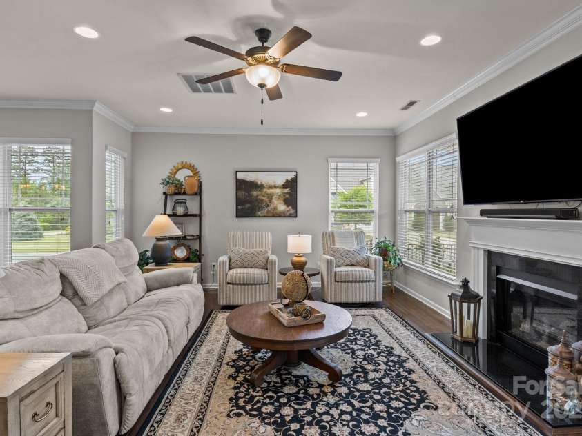 16034 Rushwick Drive, Huntersville, NC 28078.  MLS# CAR4262990, YatesRealty ID 26972. Living room w/ fireplace & recessed lighting