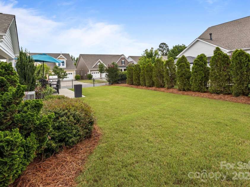 16034 Rushwick Drive, Huntersville, NC 28078.  MLS# CAR4262990, YatesRealty ID 26972. Rear yard w/ landscaping privacy screen