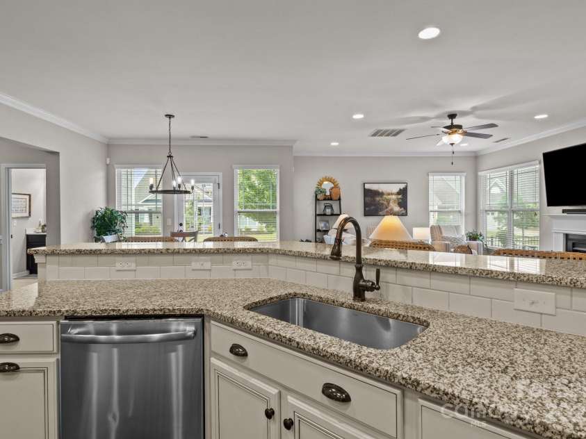 16034 Rushwick Drive, Huntersville, NC 28078.  MLS# CAR4262990, YatesRealty ID 26972. Sink with breakfast bar overlooking family room