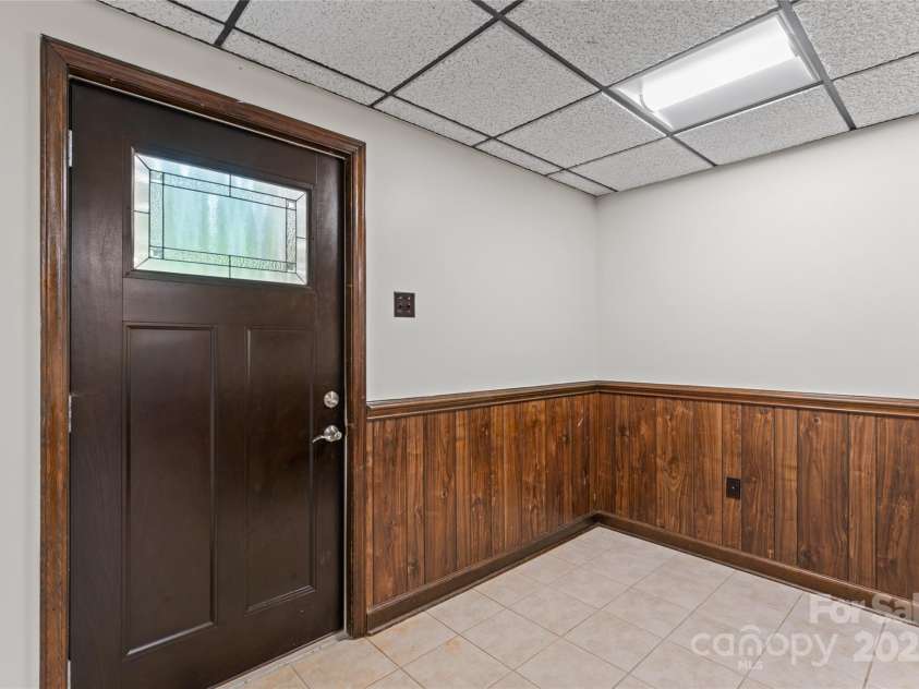 3943 Peggy Lane, Mint Hill, NC 28227.  MLS# CAR4274515, YatesRealty ID 26978. Basement entrance from side of house