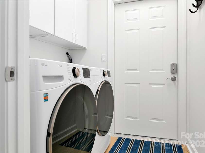 99 Ridgetop Circle, Brevard, NC 28712.  MLS# CAR4282824, YatesRealty ID 26984. Laundry Room is complete with brand new LG 