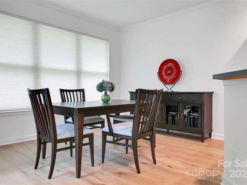 99 Ridgetop Circle, Brevard, NC 28712.  MLS# CAR4282824, YatesRealty ID 26984. The dining room is just off of the living room and conveniently right next to the kitchen! The whole house theme continues with the White Oak floors and Hunter Douglas blinds.