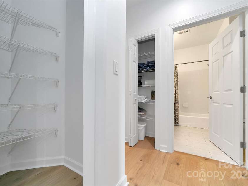 99 Ridgetop Circle, Brevard, NC 28712.  MLS# CAR4282824, YatesRealty ID 26984. Wide and spacious pantry in the kitchen. Linen closet and second bathroom across the hall.