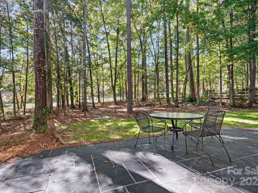 16033 Agincourt Drive, Huntersville, NC 28078.  MLS# CAR4313163, YatesRealty ID 2699. Picturesque setting overlooking the tree lined back yard with views of the 14th fairway