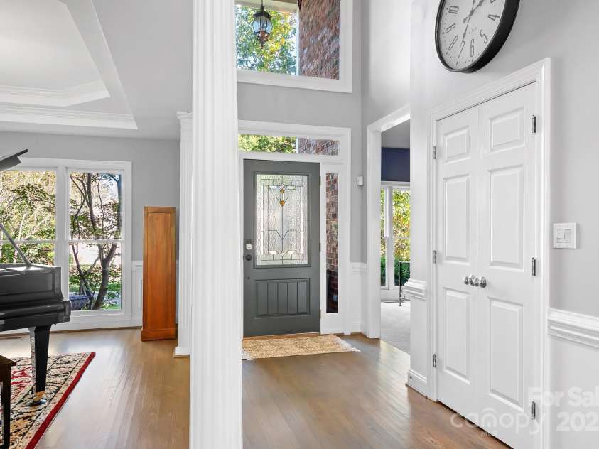 16033 Agincourt Drive, Huntersville, NC 28078.  MLS# CAR4313163, YatesRealty ID 2699. View of front door, office to the right of the photo and formal dining room/piano room to the left in the photo