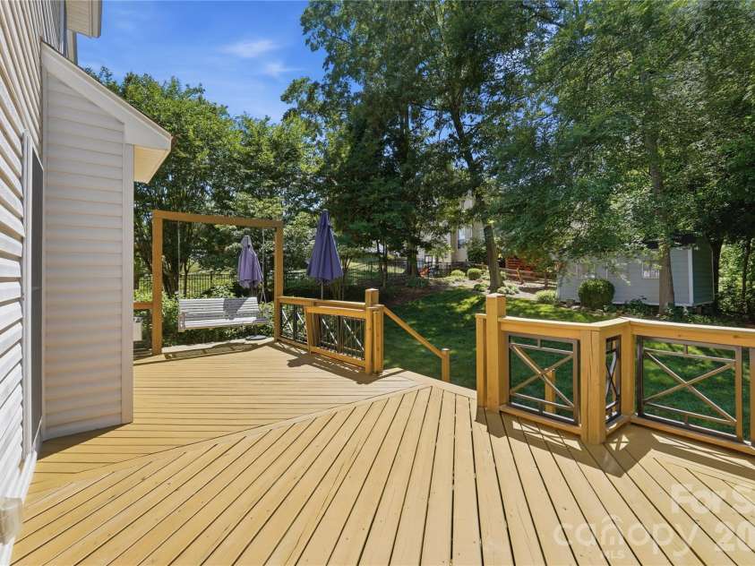 157 Lighthouse Road, Mount Holly, NC 28120.  MLS# CAR4379658, YatesRealty ID 26991. Rear deck with swing