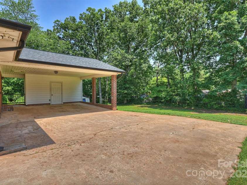 1008 Dumbarton Road, Gastonia, NC 28054.  MLS# CAR4275369, YatesRealty ID 26994. 2 car carport with storage closet!