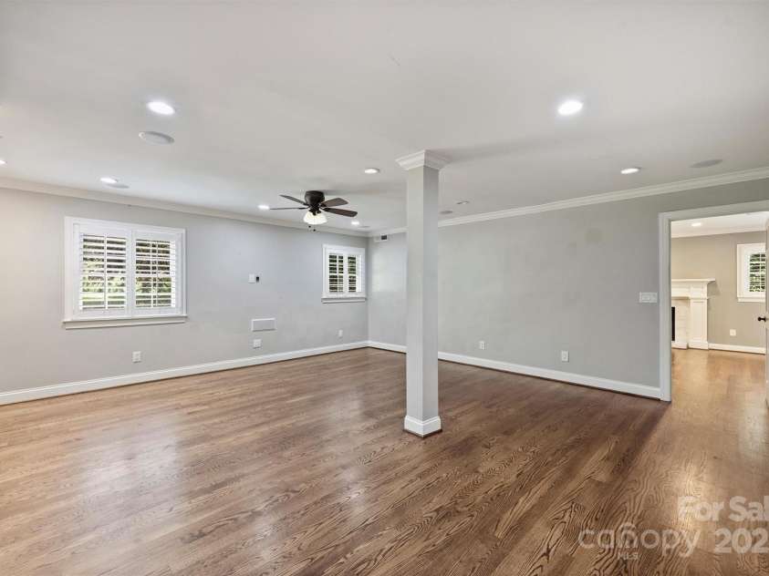 1008 Dumbarton Road, Gastonia, NC 28054.  MLS# CAR4275369, YatesRealty ID 26994. Great family room on the lower level with recessed lighting, ceiling fan, surround sound and built-ins!