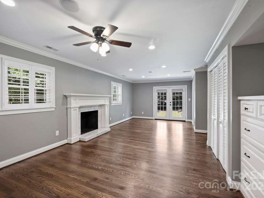 1008 Dumbarton Road, Gastonia, NC 28054.  MLS# CAR4275369, YatesRealty ID 26994. Primary bedroom on the lower level with a fireplace and french doors!