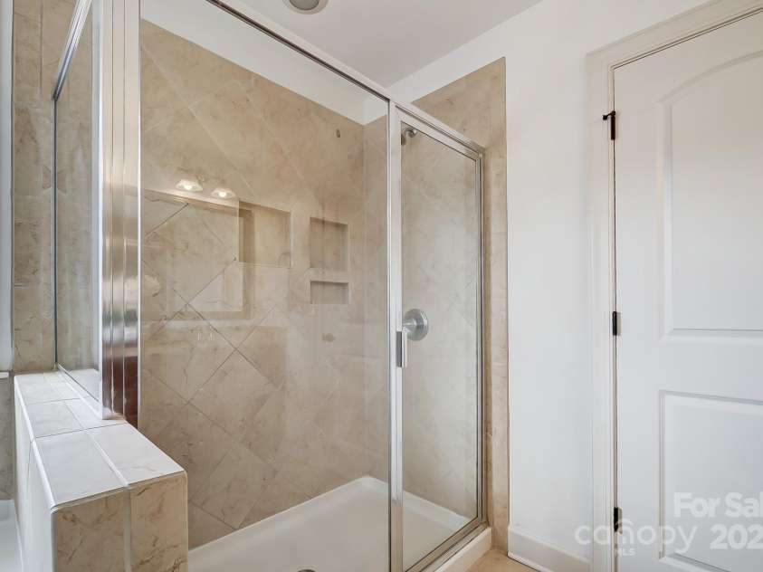 5006 Sand Trap Court, Monroe, NC 28112.  MLS# CAR4225761, YatesRealty ID 26996. Primary tiled shower