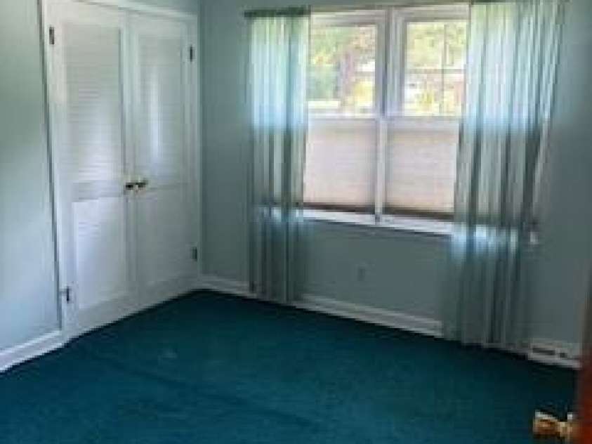 5806 Whitingham Drive, Charlotte, NC 28215.  MLS# CAR4263834, YatesRealty ID 27000. 2nd Bedroom. Hardwoods underneath carpet.