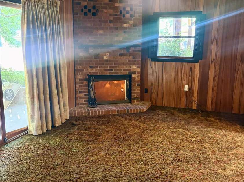 5806 Whitingham Drive, Charlotte, NC 28215.  MLS# CAR4263834, YatesRealty ID 27000. Den, fireplace view. Lower level.